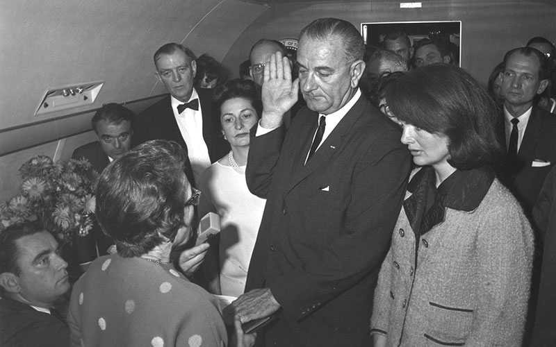 Lyndon B. Johnson takes the oath of office on Air Force